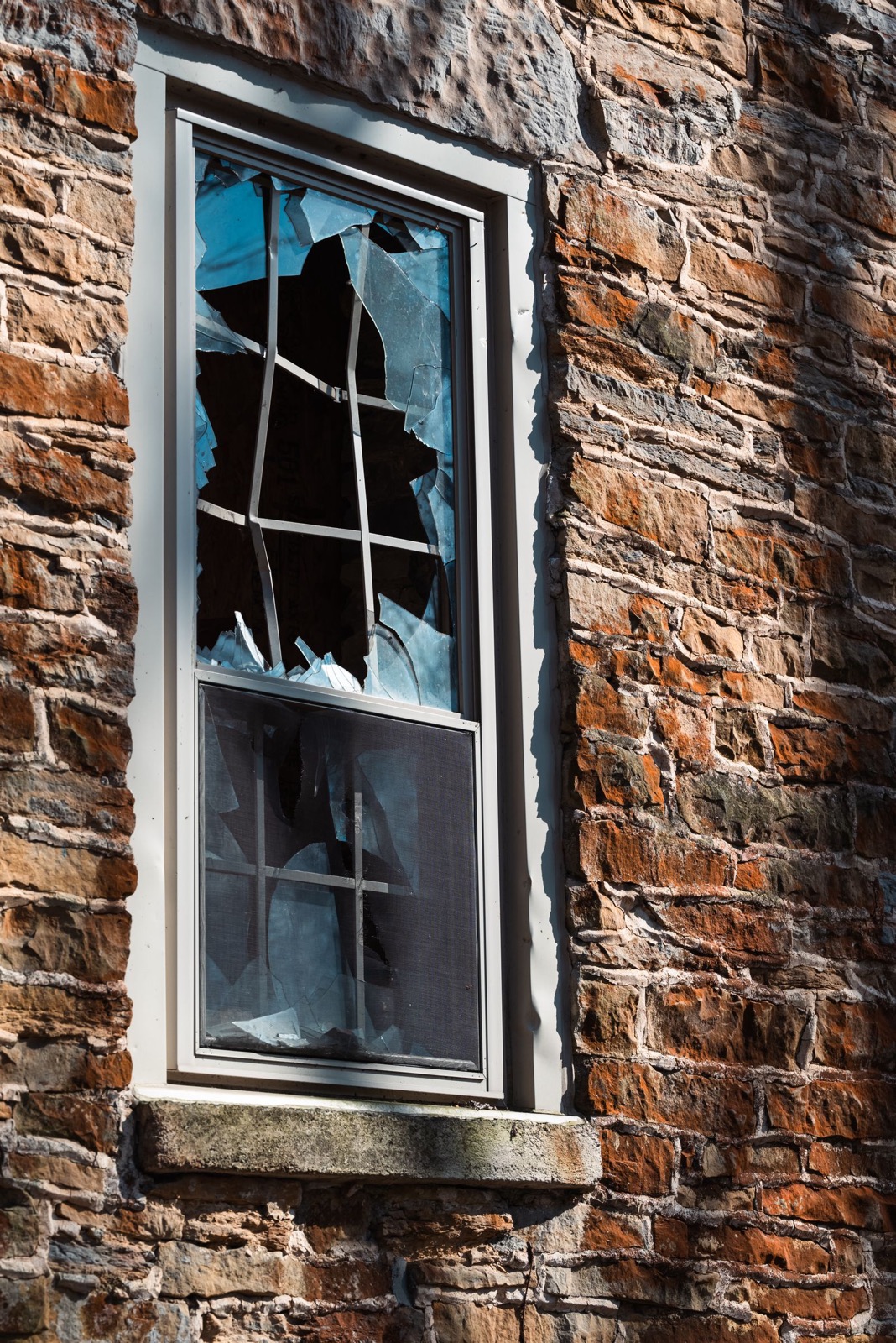 Broken commercial glass requiring emergency board-up